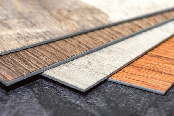 An assortment of wood flooring types, featuring luxury vinyl tile selections from a flooring service in Austin, TX.